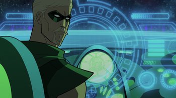 Movie still from “Green Lantern: Beware My Power” (2022), directed by Jeff Wamester – A man with a green mask is standing in front of a futuristic background; Medium shot, Over the shoulder angle