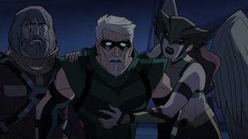 Movie still from “Green Lantern: Beware My Power” (2022), directed by Jeff Wamester – A group of people standing next to each other in a room; Medium shot, High angle