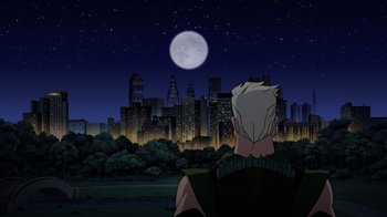 Movie still from “Green Lantern: Beware My Power” (2022), directed by Jeff Wamester – A man looking at a full moon in the night sky; Wide shot, Low angle