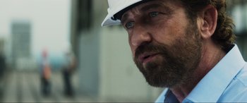 Movie still from “Greenland” (2020), directed by Ric Roman Waugh – A person wearing a hard hat; Close Up shot, Over the shoulder angle