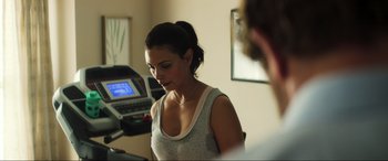Movie still from “Greenland” (2020), directed by Ric Roman Waugh – A woman standing in front of a computer monitor; Close Up shot, Over the shoulder angle