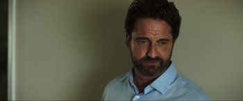 Movie still from “Greenland” (2020), directed by Ric Roman Waugh – A person wearing a blue shirt; Close Up shot, Low angle