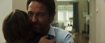 Movie still from “Greenland” (2020), directed by Ric Roman Waugh – A person wearing a shirt and tie; Close Up shot, Over the shoulder angle