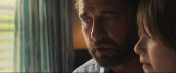 Movie still from “Greenland” (2020), directed by Ric Roman Waugh – A person with a beard; Close Up shot, Over the shoulder angle