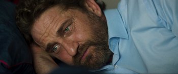 Movie still from “Greenland” (2020), directed by Ric Roman Waugh – A person with a beard; Close Up shot, Over the shoulder angle