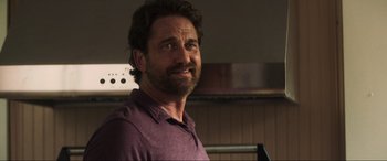 Movie still from “Greenland” (2020), directed by Ric Roman Waugh – A person wearing a purple shirt; Close Up shot, Over the shoulder angle