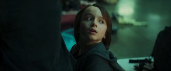 Movie still from “Greenland” (2020), directed by Ric Roman Waugh – A young girl looking up into the air; Close Up shot, Low angle