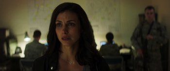 Movie still from “Greenland” (2020), directed by Ric Roman Waugh – A person with long dark hair; Close Up shot, Over the shoulder angle