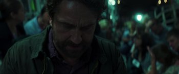 Movie still from “Greenland” (2020), directed by Ric Roman Waugh – A person looking down at his face; Close Up shot, Over the shoulder angle