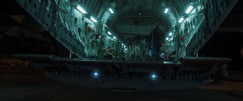 Movie still from “Greenland” (2020), directed by Ric Roman Waugh – A group of people standing on top of an airplane; Wide shot, High angle