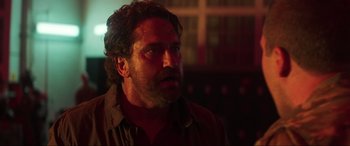 Movie still from “Greenland” (2020), directed by Ric Roman Waugh – A person wearing a shirt; Close Up shot, Over the shoulder angle