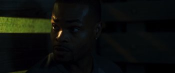 Movie still from “Greenland” (2020), directed by Ric Roman Waugh – A man's face in the dark; Close Up shot, Over the shoulder angle