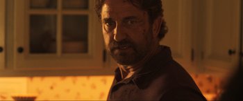 Movie still from “Greenland” (2020), directed by Ric Roman Waugh – A person with a beard; Close Up shot, Over the shoulder angle