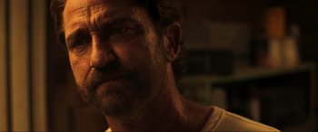 Movie still from “Greenland” (2020), directed by Ric Roman Waugh – A person with a beard; Close Up shot, Over the shoulder angle