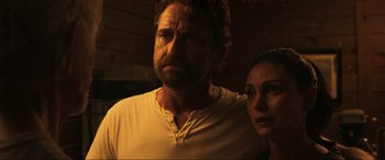 Movie still from “Greenland” (2020), directed by Ric Roman Waugh – A man and a woman standing next to each other; Close Up shot, Low angle