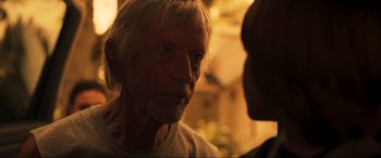 Movie still from “Greenland” (2020), directed by Ric Roman Waugh – An older man looking at a younger man; Close Up shot, Over the shoulder angle