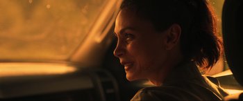 Movie still from “Greenland” (2020), directed by Ric Roman Waugh – A person looking out a car window; Close Up shot, Over the shoulder angle