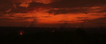 Movie still from “Greenland” (2020), directed by Ric Roman Waugh – A red sky at night with a lot of clouds; Extreme Wide shot, High angle