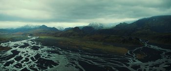 Movie still from “Greenland” (2020), directed by Ric Roman Waugh – A view of a mountain range from a plane; Extreme Wide shot, High angle