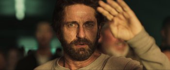 Movie still from “Greenland” (2020), directed by Ric Roman Waugh – A person with a beard; Close Up shot, Over the shoulder angle