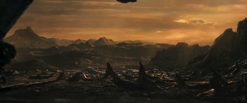 Movie still from “Greenland” (2020), directed by Ric Roman Waugh – An image of an alien landscape with mountains in the background; Extreme Wide shot, High angle