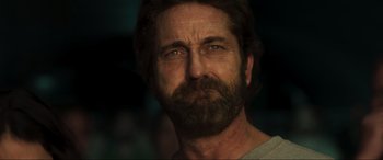 Movie still from “Greenland” (2020), directed by Ric Roman Waugh – A person with a beard; Close Up shot, Over the shoulder angle