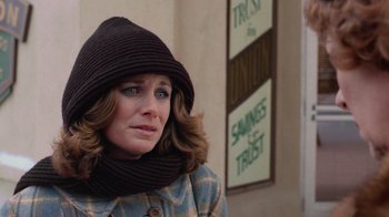 Movie still from “Gremlins” (1984), directed by Joe Dante – A person wearing a hat and a scarf; Close Up shot, Low angle