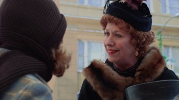 Movie still from “Gremlins” (1984), directed by Joe Dante – An older woman talking to a younger woman in a hat; Close Up shot, Over the shoulder angle