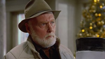 Movie still from “Gremlins” (1984), directed by Joe Dante – An old man with a beard wearing a hat; Close Up shot, Low angle