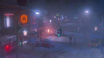Movie still from “Gremlins” (1984), directed by Joe Dante – A car parked on the side of the road at night; Extreme Wide shot, High angle
