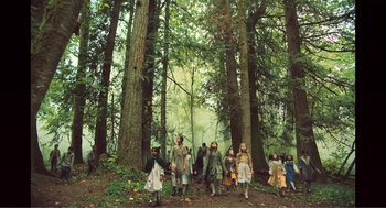 Movie still from “Gretel & Hansel” (2020), directed by Oz Perkins – A group of children in costumes in the woods; Wide shot, High angle