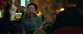 Movie still from “Greyhound” (2020), directed by Aaron Schneider – A woman wearing a hat sitting next to another woman; Medium shot, Over the shoulder angle