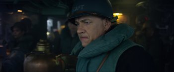 Movie still from “Greyhound” (2020), directed by Aaron Schneider – A man wearing a hat and a jacket; Close Up shot, Over the shoulder angle