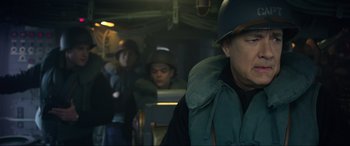 Movie still from “Greyhound” (2020), directed by Aaron Schneider – A group of people on a boat in the water; Close Up shot, Over the shoulder angle