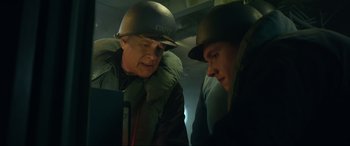Movie still from “Greyhound” (2020), directed by Aaron Schneider – Two men in military uniforms looking at each other; Close Up shot, Low angle