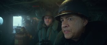 Movie still from “Greyhound” (2020), directed by Aaron Schneider – Two men in military uniforms in a vehicle; Close Up shot, Low angle
