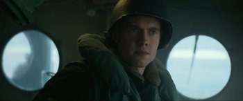 Movie still from “Greyhound” (2020), directed by Aaron Schneider – A man wearing a helmet and a jacket; Close Up shot, Low angle