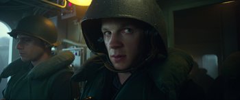 Movie still from “Greyhound” (2020), directed by Aaron Schneider – A person wearing a helmet; Close Up shot, Low angle