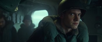Movie still from “Greyhound” (2020), directed by Aaron Schneider – A man wearing a helmet and a jacket; Close Up shot, Low angle
