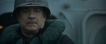 Movie still from “Greyhound” (2020), directed by Aaron Schneider – A person wearing a helmet; Close Up shot, High angle