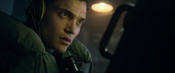 Movie still from “Greyhound” (2020), directed by Aaron Schneider – A person looking at a camera; Close Up shot, Low angle