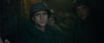 Movie still from “Greyhound” (2020), directed by Aaron Schneider – A group of men in military uniforms in a bus; Close Up shot, Low angle