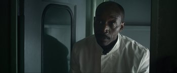 Movie still from “Greyhound” (2020), directed by Aaron Schneider – A man in a white dress shirt and a tie; Close Up shot, Low angle