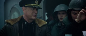 Movie still from “Greyhound” (2020), directed by Aaron Schneider – A man in a military uniform and a woman in a uniform; Close Up shot, Over the shoulder angle
