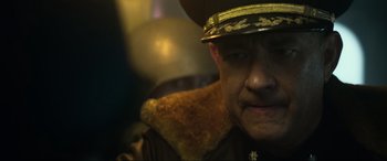 Movie still from “Greyhound” (2020), directed by Aaron Schneider – A person wearing a hat; Close Up shot, Over the shoulder angle