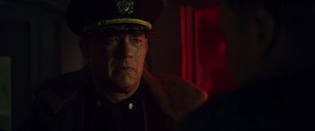 Movie still from “Greyhound” (2020), directed by Aaron Schneider – A person wearing a uniform; Close Up shot, Over the shoulder angle