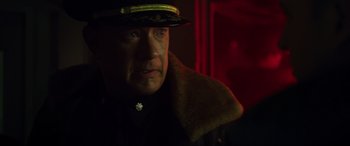 Movie still from “Greyhound” (2020), directed by Aaron Schneider – A person wearing a hat; Close Up shot, Over the shoulder angle