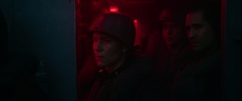 Movie still from “Greyhound” (2020), directed by Aaron Schneider – A man wearing a helmet in a dark room; Close Up shot, Low angle