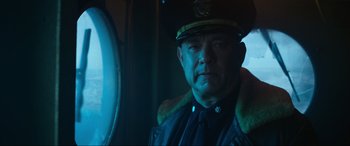 Movie still from “Greyhound” (2020), directed by Aaron Schneider – A person wearing a uniform; Close Up shot, Low angle