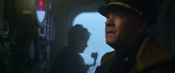 Movie still from “Greyhound” (2020), directed by Aaron Schneider – A person wearing a uniform; Close Up shot, Low angle